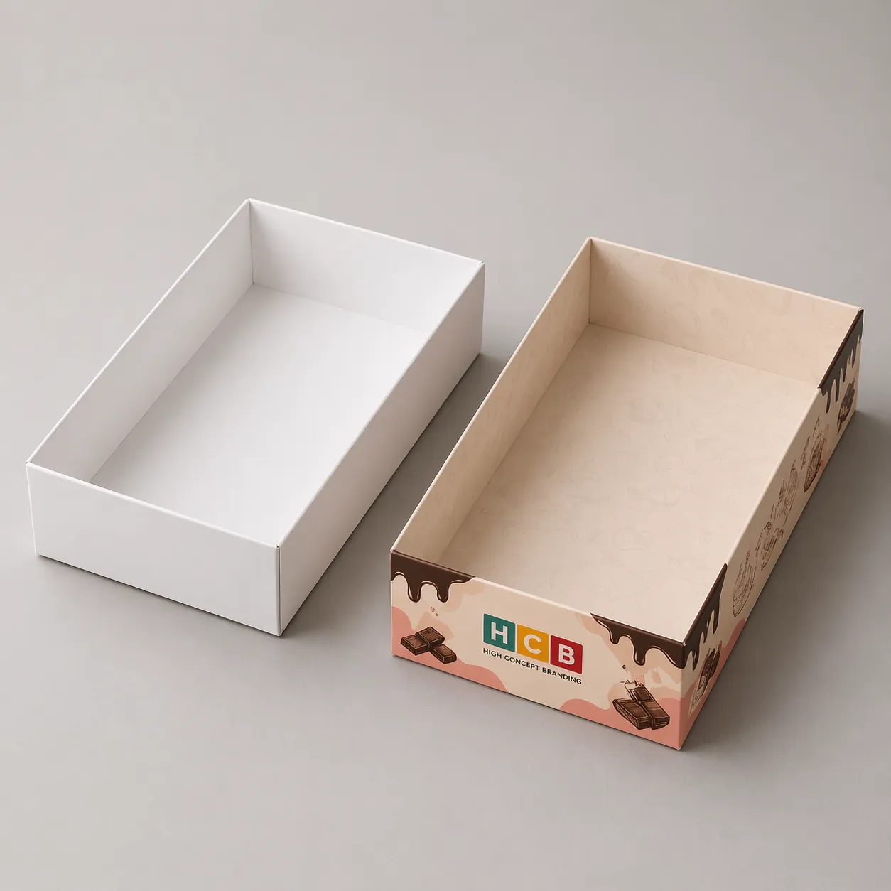 Two shallow cardboard trays, one plain white and one with elegant chocolate themed branding designs. class=